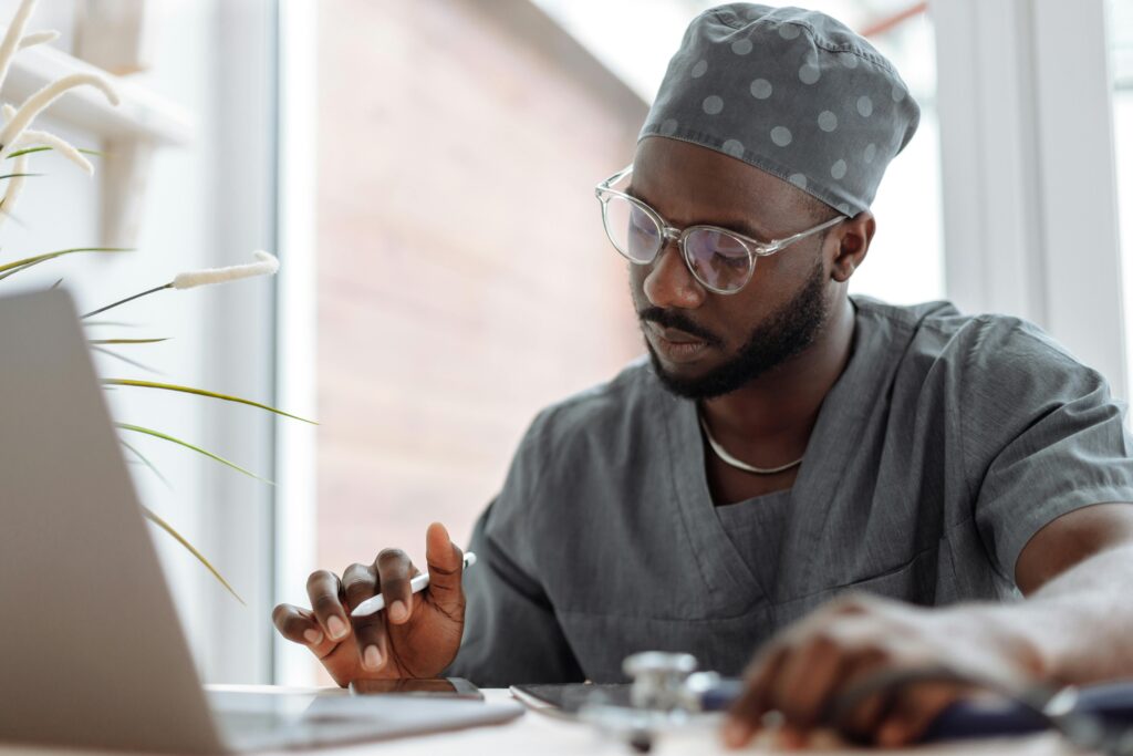 phlebotomist studying on the computer