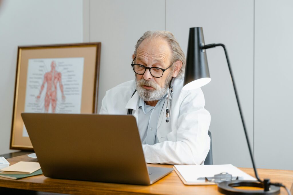 Doctor on his computer in medical office 